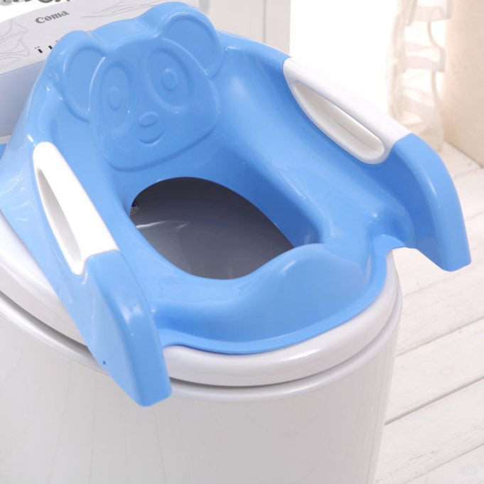 Blue children's toilet seat with panda design on a white toilet