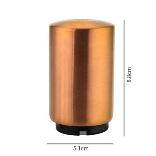 Bronze-colored cylindrical beer bottle opener with dimensions on a white background