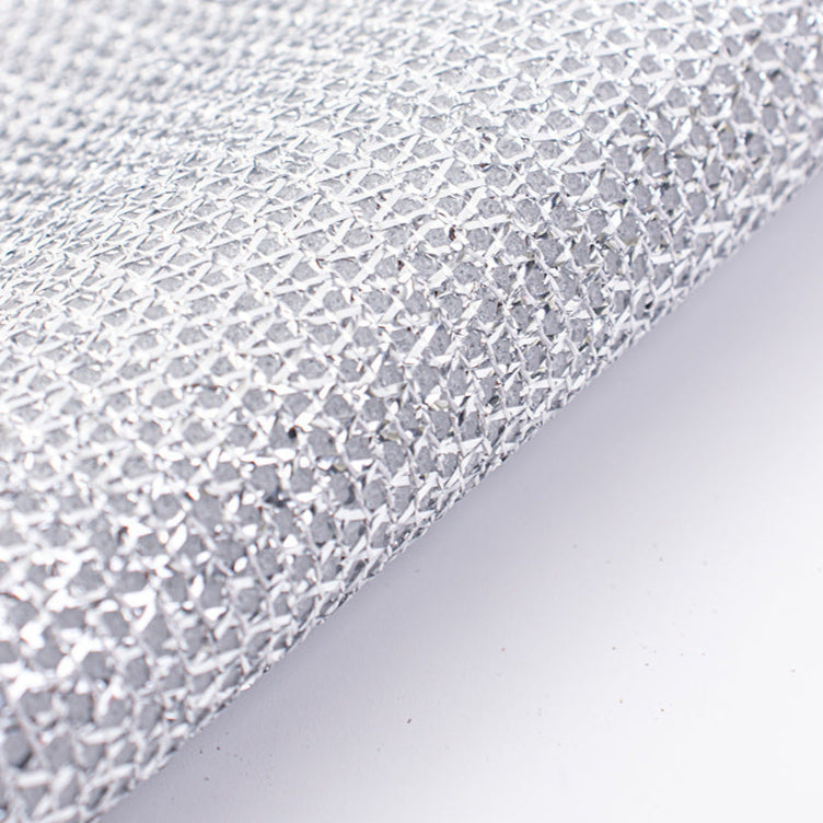 Close-up of a non-scratch wire dishcloth on a light gray background