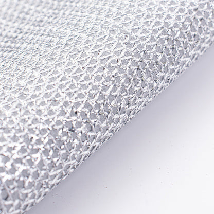 Close-up of a non-scratch wire dishcloth on a light gray background
