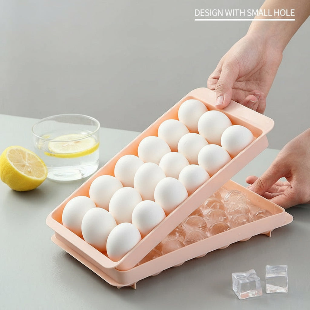 Person holding a pink ice freezing tray with small holes on a gray surface.