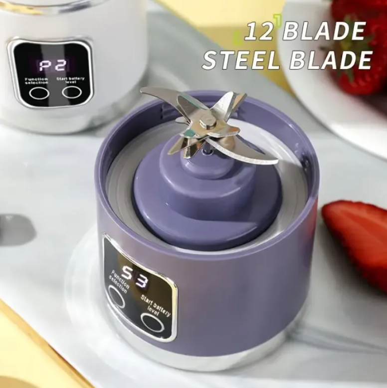 Purple blender with a metal blade on a white surface with strawberries in the background