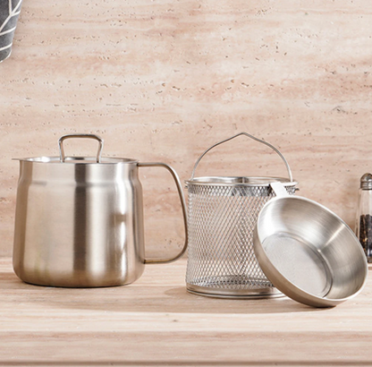 Set of stainless steel oil pot strainer on a wooden surface
